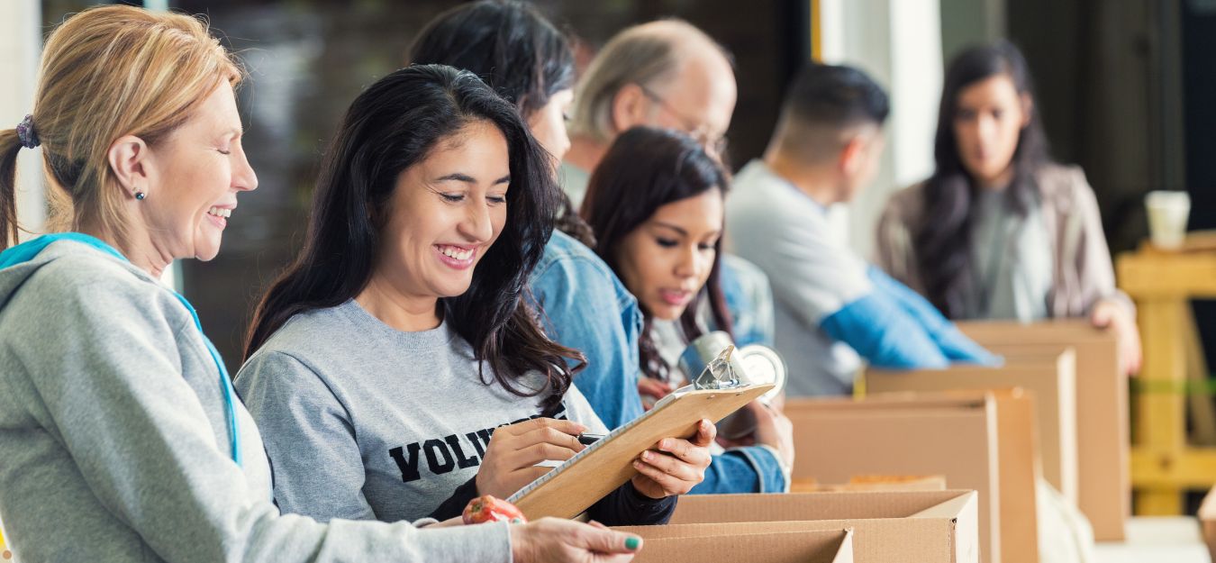 Volunteers sorting donations at a food bank.